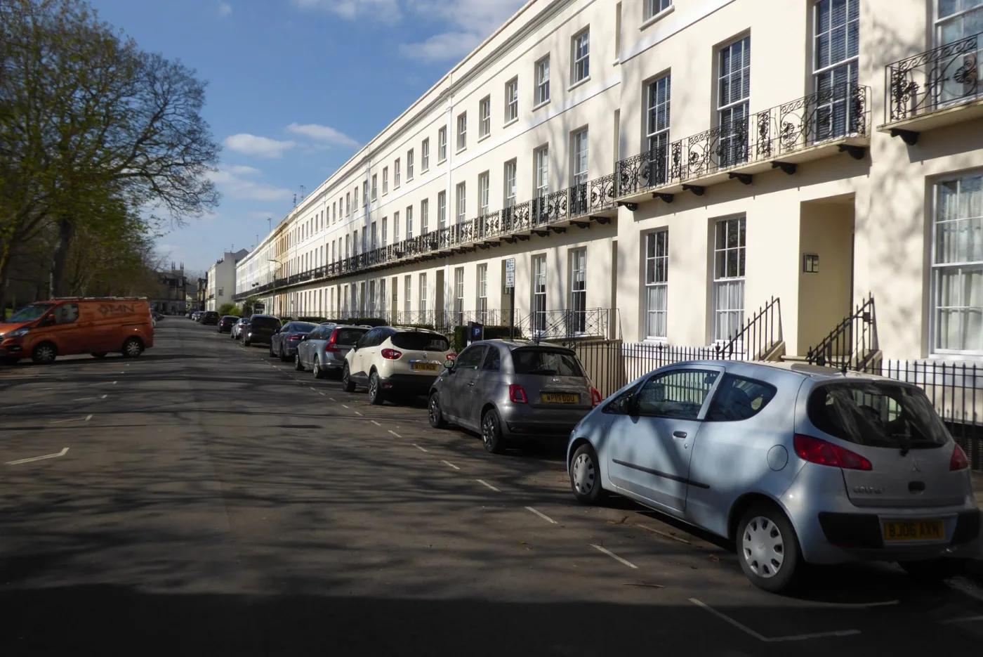 Pay and display bays outside a Regency terrace on Montpellier Spa Road, Cheltenham
